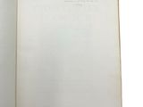 an open book with a handwritten page in it on a white background