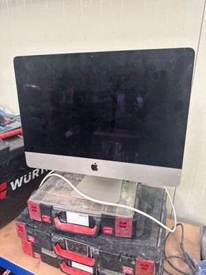 a computer monitor sitting on top of a stack of boxes