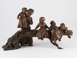 a bronze statue of a group of children riding on a horse