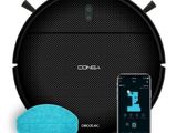a black robot vacuum cleaner with a blue sponge next to it