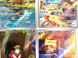 four pokemon cards with different designs on them sitting on a table