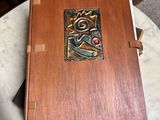 a wooden box with a picture on it on a table