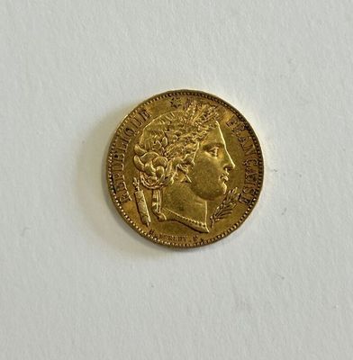 a gold coin with a picture of a woman on it