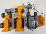 three toy vehicles that are sitting on a table