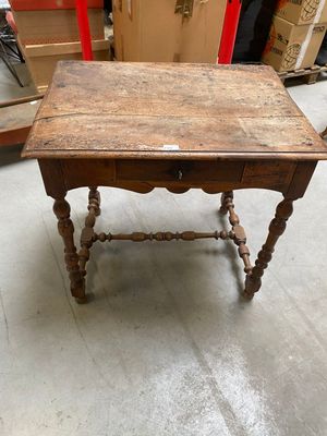 a small table with a drawer on top of it