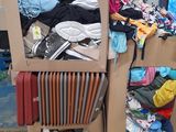 a cardboard box with clothes on top of it