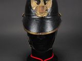 a close up of a helmet on a mannequin head with a red cord