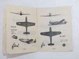 a book with pictures of airplanes on it on a table