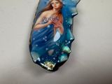 a picture of a woman that is painted on a piece of glass