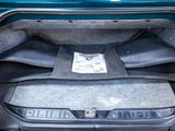 a trunk of a car with a seat folded down