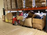 many boxes and boxes stacked on a shelf in a warehouse