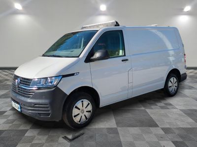the white van is parked on a checkered floor in a room