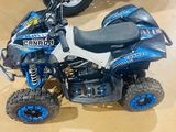 an image of a blue and black four wheeler atv