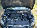 a black car with its hood open and the hood open