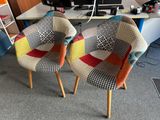two chairs that are sitting in front of a computer