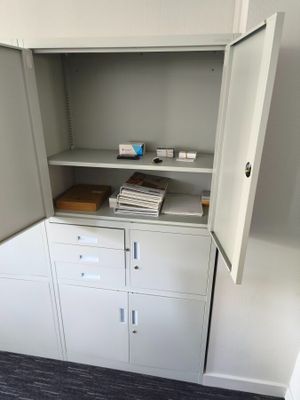 a cabinet with a bunch of files in it