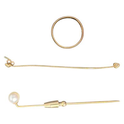 two pairs of gold earrings and a ring on a white background