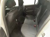 the back seats of a small car are black and grey