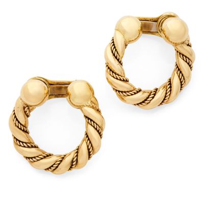 PAIRE DE CRÉOLES ornée d'un motif torsadé se terminant par d…