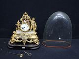 a clock and a clochet sitting on a table