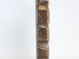 rectangular stone vase in brown and gold tones on a white background
