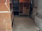 an image of a garage with a lot of furniture in it