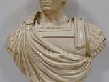 marble bust of a man with a draped cloth around his neck