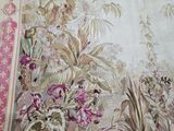 a picture of a wall hanging with a bunch of flowers on it