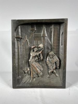 une image représentant une plaque métallique sur laquelle figurent un homme et une femme