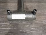 an image of a metal pipe on a wooden table