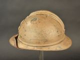 a helmet that is on a stand on a gray background