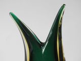 a close up of a green glass vase with a gold stripe