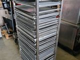several trays of food are stacked on top of each other in a warehouse