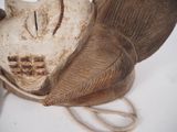 a wooden sculpture of a cat with a hat on it ' s head