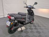 a scooter that is parked in a garage