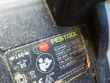 a close up of a sander on a table in a room