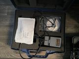 a case with a laptop and a cell phone inside of it