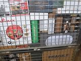 a metal cart with many items in it in a warehouse