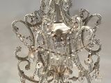 chandelier made of silver metal and crystal beads with a white background