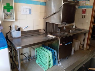 an image of a kitchen with a sink and a stove