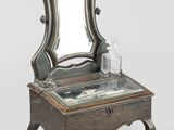 a small table with a mirror on top of it