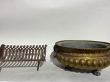 pair of antique brass planters and a cast iron bench on a white background