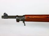 a close up of a rifle on a white surface with a white background