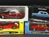 three toy cars in the boxes on the table