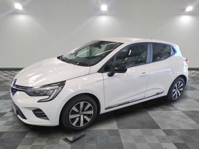 a white car is parked in a room with a checkered floor