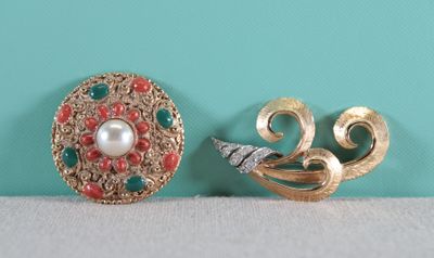 pair of vintage brooches and earrings on a table
