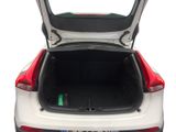 the back of a white car with its trunk open on a white background