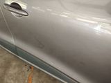 a close up of a car door handle with a sticker on it