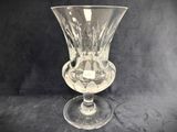 a glass vase that is sitting on a table