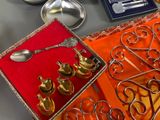 a box with a spoon, spoon, and other items on it